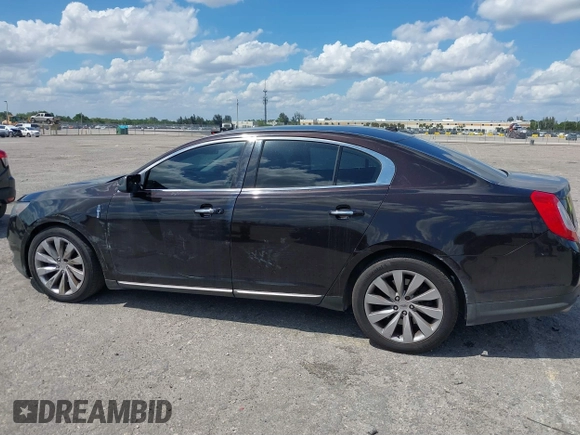 2014 Lincoln MKS with VIN 1LNHL9EK0EG608300, listed as a IAAI auction lot 41900902 with 144,253 mi miles. Bid and sale history available at carsss.com. Image 14.
