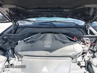 2016 BMW X5 xDrive50i with VIN 5UXKR6C51G0J81658, listed as a IAAI auction lot 41801382 with 34,572 mi miles. Bid and sale history available at carsss.com. Image 10.