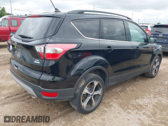 2018 Ford Escape SEL with VIN 1FMCU0HD0JUB24722, listed as a IAAI auction lot 42049106 with 122,400 mi miles and . Bid and sale history available at carsss.com. Image 4.