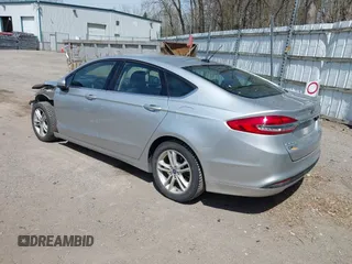 2018 Ford Fusion SE z VIN 3FA6P0H77JR226390, wystawiony jako IAAI lot #42120981 z przebiegiem 114 057 mil mil oraz . Historia ofert i sprzedaży dostępna na DreamBid. Obrazek 3.