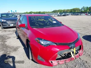 2018 Toyota Corolla L z VIN 2T1BURHE6JC057196, wystawiony jako IAAI lot #42305307 z przebiegiem 106 670 mil mil oraz . Historia ofert i sprzedaży dostępna na DreamBid. Obrazek 1.
