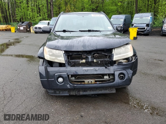 2006 Suzuki Grand Vitara Luxury with VIN JS3TD947364101307, listed as a Copart auction lot 55037585 with 198,616 mi miles and Salvage title. Bid and sale history available at DreamBid. Image 5.