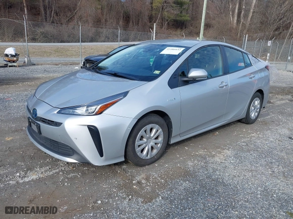 2021 Toyota Prius L Eco with VIN JTDKAMFU7M3143961, listed as a IAAI auction lot 41486032 with 58,979 mi miles. Bid and sale history available at carsss.com. Image 18.