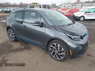 2017 BMW i3 z VIN WBY1Z8C39HV891353, wystawiony jako IAAI lot #41887562 z przebiegiem 82 295 mil mil oraz . Historia ofert i sprzedaży dostępna na DreamBid. Obrazek 1.