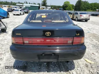 1994 Toyota Camry LE z VIN 4T1SK12E6RU408523, wystawiony jako Copart lot #56314665 z przebiegiem 221 867 mil mil oraz Szkoda całkowita • Salvage title. Historia ofert i sprzedaży dostępna na DreamBid. Obrazek 6.