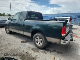2001 Ford F-150 XL with VIN 1FTRX17L51NA83857, listed as a Copart auction lot 62759145 with 215,961 mi miles and Salvage title. Bid and sale history available at DreamBid. Image 2.