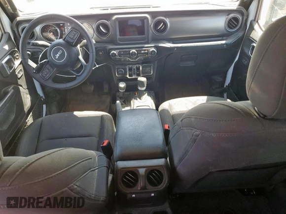 2023 Jeep Gladiator Sport S with VIN 1C6HJTAG4PL564716, listed as a Copart auction lot 57489125 with 20,971 mi miles and Salvage title. Bid and sale history available at DreamBid. Image 8.