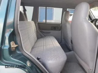 1998 Jeep Cherokee Sport with VIN 1J4FT68S2WL236774, listed as a Copart auction lot 77388734 with 128,591 mi miles and Clean Title. Bid and sale history available at carsss.com. Image 10.