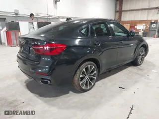 2019 BMW X6 xDrive35i with VIN 5UXKU2C51K0Z64897, listed as a IAAI auction lot 41759156 with 64,434 mi miles. Bid and sale history available at carsss.com. Image 4.