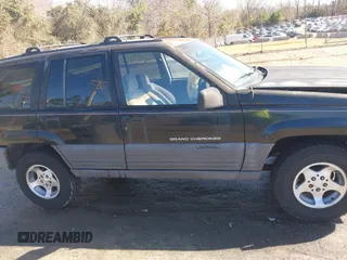 1996 Jeep Grand Cherokee Laredo with VIN 1J4GZ58S9TC268615, listed as a IAAI auction lot 41527984 with 248,443 mi miles. Bid and sale history available at carsss.com. Image 13.