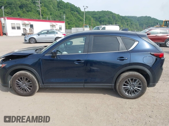 2021 Mazda CX-5 Touring z VIN JM3KFBCMXM0389857, wystawiony jako IAAI lot #42309650 z przebiegiem 49 938 mil mil oraz . Historia ofert i sprzedaży dostępna na DreamBid. Obrazek 14.