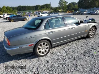2005 Jaguar XJ with VIN SAJWA79C65SG45989, listed as a Copart auction lot 65357044 with 103,587 mi miles and Salvage Title. Bid and sale history available at carsss.com. Image 3.