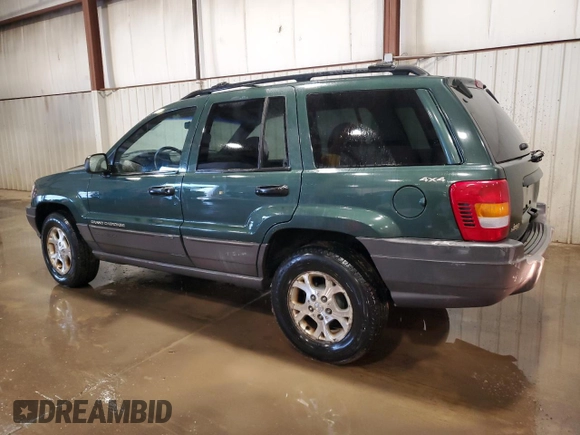 2000 Jeep Grand Cherokee Laredo with VIN 1J4GW48S2YC256123, listed as a Copart auction lot 56015855 with 147,549 mi miles and Salvage title. Bid and sale history available at DreamBid. Image 2.