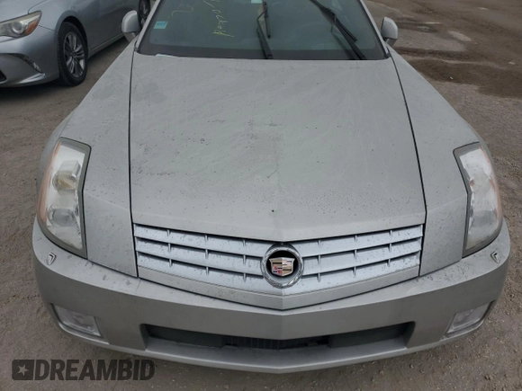 2008 Cadillac XLR z VIN 1G6YV36A285600199, wystawiony jako Copart lot #76229514 z przebiegiem Nie podano mil oraz Szkoda całkowita • Salvage title. Historia ofert i sprzedaży dostępna na DreamBid. Obrazek 11.