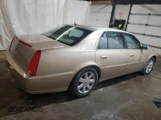 2006 Cadillac DTS 1SC z VIN 1G6KD57Y76U141402, wystawiony jako Copart lot #58715675 z przebiegiem 148 042 mil mil oraz Szkoda całkowita • Salvage title. Historia ofert i sprzedaży dostępna na DreamBid. Obrazek 3.