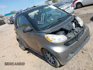 2009 Smart fortwo Pure with VIN WMEEJ31X99K302227, listed as a IAAI auction lot 41900573 with 30,730 mi miles. Bid and sale history available at carsss.com. Image 1.