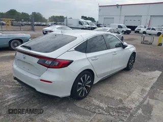 2023 Honda Civic EX-L with VIN 19XFL1H70PE014510, listed as a IAAI auction lot 42395890 with 14,163 mi miles and . Bid and sale history available at DreamBid. Image 4.