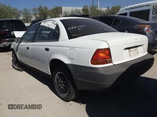 1998 Saturn SL with VIN 1G8ZH5281WZ186209, listed as a Copart auction lot 54977735 with Not provided miles and Non repairable. Bid and sale history available at DreamBid. Image 2.