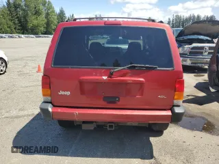 1999 Jeep Cherokee Sport z VIN 1J4FF68SXXL525944, wystawiony jako Copart lot #57653905 z przebiegiem 102 057 mil mil oraz Szkoda całkowita • Salvage title. Historia ofert i sprzedaży dostępna na DreamBid. Obrazek 6.