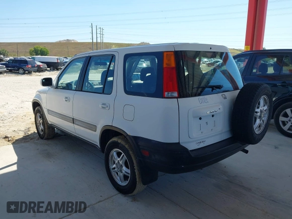 1999 Honda CR-V EX with VIN JHLRD1860XC037846, listed as a IAAI auction lot 42037921 with 164,477 mi miles. Bid and sale history available at carsss.com. Image 3.