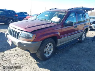 1999 Jeep Grand Cherokee Laredo with VIN 1J4GW58S5XC781472, listed as a IAAI auction lot 41738515 with 216,000 mi miles. Bid and sale history available at carsss.com. Image 2.