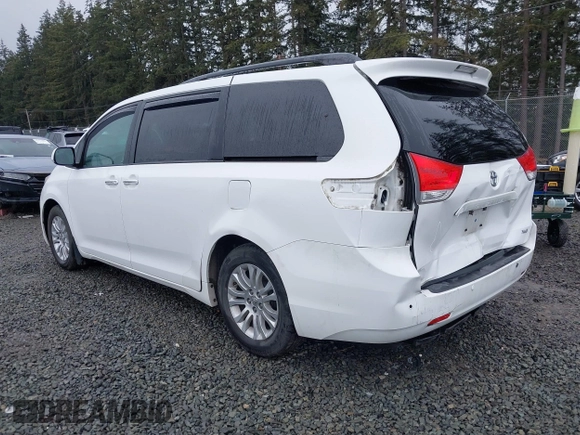 2014 Toyota Sienna XLE with VIN 5TDYK3DC2ES485846, listed as a IAAI auction lot 41693092 with 106,156 mi miles and . Bid and sale history available at DreamBid. Image 3.