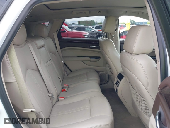 2016 Cadillac SRX Luxury Collection z VIN 3GYFNBE33GS507014, wystawiony jako IAAI lot #41979980 z przebiegiem 115 077 mil mil oraz . Historia ofert i sprzedaży dostępna na DreamBid. Obrazek 8.