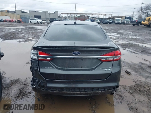 2017 Ford Fusion Hybrid Titanium z VIN 3FA6P0RU6HR279726, wystawiony jako IAAI lot #41736889 z przebiegiem 123 698 mil mil oraz . Historia ofert i sprzedaży dostępna na DreamBid. Obrazek 16.