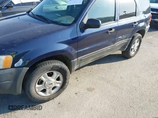 2003 Ford Escape XLT Popular 2 with VIN 1FMYU93103KE17610, listed as a IAAI auction lot 41766806 with 1 mi miles. Bid and sale history available at carsss.com. Image 12.