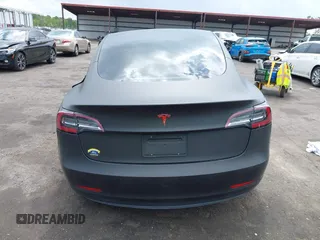 2022 Tesla Model 3 with VIN 5YJ3E1EA3NF287512, listed as a IAAI auction lot 42000557 with 77,619 mi miles. Bid and sale history available at carsss.com. Image 15.