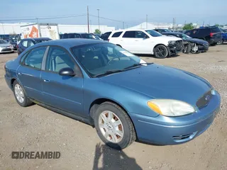 2005 Ford Taurus SE z VIN 1FAFP53U15A297031, wystawiony jako IAAI lot #42804484 z przebiegiem 91 384 mil mil oraz . Historia ofert i sprzedaży dostępna na DreamBid. Obrazek 1.