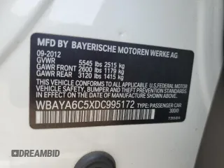 2013 BMW 7 Series 740i with VIN WBAYA6C5XDC995172, listed as a Copart auction lot 60288685 with 28,144 mi miles and Salvage title. Bid and sale history available at DreamBid. Image 13.