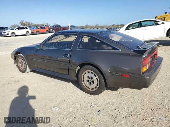 1986 Nissan 300ZX z VIN JN1HZ16S9GX094097, wystawiony jako Copart lot #75251134 z przebiegiem Nie podano mil oraz Szkoda całkowita • Salvage title. Historia ofert i sprzedaży dostępna na DreamBid. Obrazek 2.
