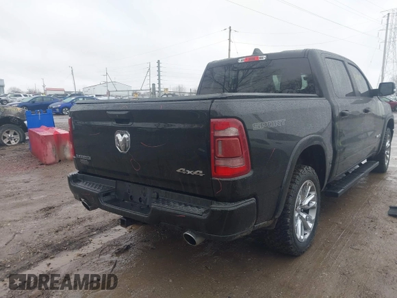 2021 Ram 1500 Laramie with VIN 1C6SRFJT6MN580803, listed as a IAAI auction lot 41207914 with 56,891 mi miles and . Bid and sale history available at DreamBid. Image 4.