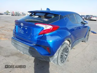 2019 Toyota C-HR XLE with VIN NMTKHMBX3KR098510, listed as a IAAI auction lot 41289899 with 112,981 mi miles. Bid and sale history available at carsss.com. Image 4.