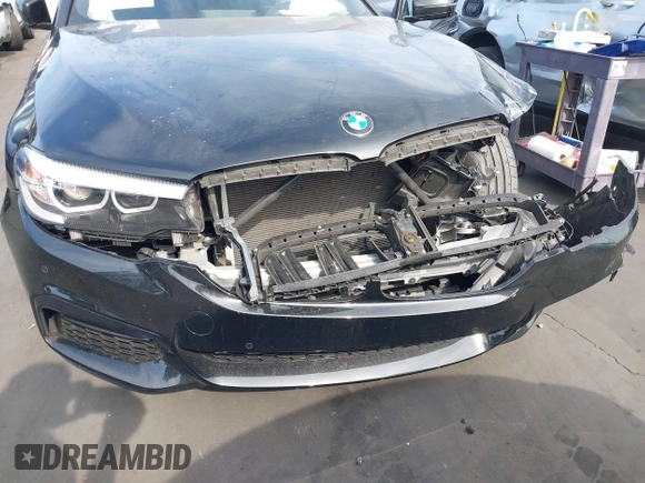 2018 BMW 5 Series 540i z VIN WBAJE5C5XJWA97667, wystawiony jako IAAI lot #41481362 z przebiegiem Nie podano mil oraz . Historia ofert i sprzedaży dostępna na DreamBid. Obrazek 19.