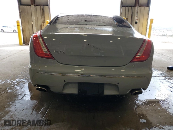 2013 Jaguar XJ with VIN SAJWJ1CD1D8V51462, listed as a Copart auction lot 50527985 with 62,995 mi miles and Salvage title. Bid and sale history available at DreamBid. Image 6.