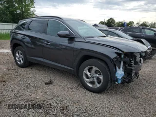 2023 Hyundai Tucson SEL with VIN 5NMJBCAE5PH186784, listed as a Copart auction lot 62896985 with 13,633 mi miles and Salvage title. Bid and sale history available at DreamBid. Image 4.