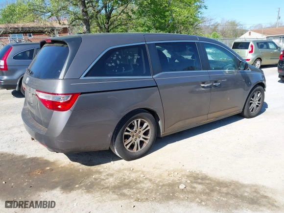 2011 Honda Odyssey EX-L with VIN 5FNRL5H60BB072101, listed as a IAAI auction lot 42002097 with 243,607 mi miles. Bid and sale history available at carsss.com. Image 4.