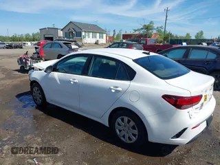 2022 Kia Rio S with VIN 3KPA24AD7NE492807, listed as a IAAI auction lot 42050520 with 100,756 mi miles. Bid and sale history available at carsss.com. Image 3.