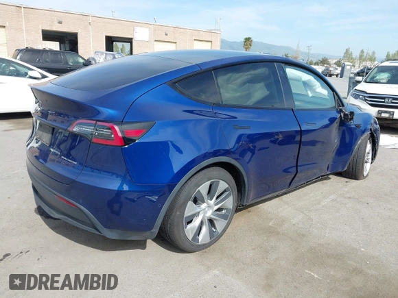 2020 Tesla Model Y Long Range with VIN 5YJYGDEE1LF006227, listed as a IAAI auction lot 42100833 with 49,761 mi miles and . Bid and sale history available at DreamBid. Image 4.