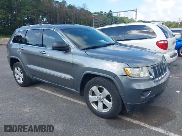 2011 Jeep Grand Cherokee Laredo with VIN 1J4RR4GG7BC736694, listed as a IAAI auction lot 42758461 with 159,875 mi miles and . Bid and sale history available at DreamBid. Image 1.
