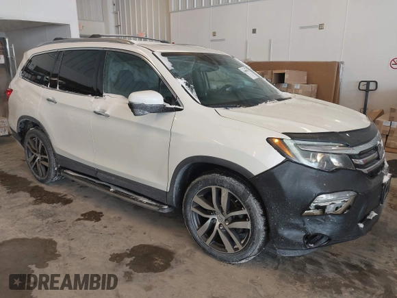 2017 Honda Pilot Touring with VIN 5FNYF6H92HB032873, listed as a IAAI auction lot 41608870 with 123,888 mi miles. Bid and sale history available at carsss.com. Image 1.