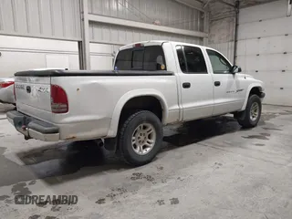 2001 Dodge Dakota Sport with VIN 1B7HG2AN31S229220, listed as a IAAI auction lot 42100843 with 134,034 mi miles. Bid and sale history available at carsss.com. Image 4.