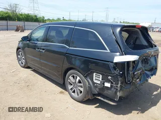 2014 Honda Odyssey Touring with VIN 5FNRL5H94EB079518, listed as a IAAI auction lot 42095098 with 141,019 mi miles and . Bid and sale history available at DreamBid. Image 3.