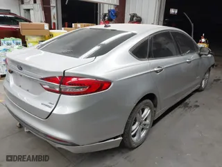 2018 Ford Fusion Hybrid SE with VIN 3FA6P0LUXJR170152, listed as a IAAI auction lot 41467621 with 150,048 mi miles. Bid and sale history available at carsss.com. Image 4.