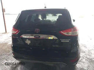 2014 Ford Escape Titanium z VIN 1FMCU0J96EUA84108, wystawiony jako IAAI lot #42114002 z przebiegiem 176 735 mil mil oraz . Historia ofert i sprzedaży dostępna na DreamBid. Obrazek 6.