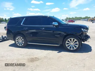 2021 Chevrolet Tahoe Premier with VIN 1GNSKSKDXMR195984, listed as a IAAI auction lot 42528305 with 89,925 mi miles and . Bid and sale history available at DreamBid. Image 14.