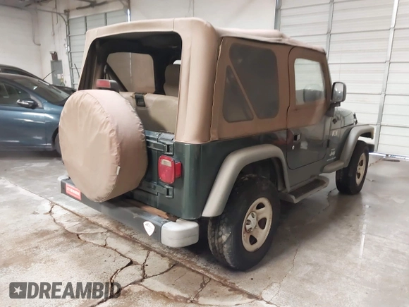 2003 Jeep Wrangler X z VIN 1J4FA39S43P339234, wystawiony jako IAAI lot #41329654 z przebiegiem 175 376 mil mil oraz . Historia ofert i sprzedaży dostępna na DreamBid. Obrazek 4.