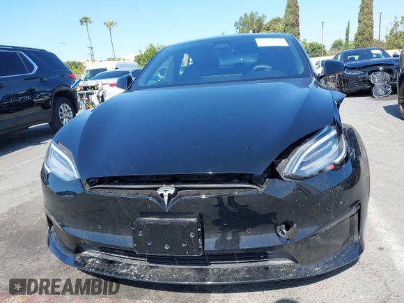 2022 Tesla Model S with VIN 5YJSA1E5XNF467435, listed as a IAAI auction lot 42538706 with 26,504 mi miles and . Bid and sale history available at DreamBid. Image 12.
